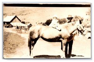 RPPC Baby Riding Horse w Papa Named Suject Marley Phillips Jr & Sr Postcard S3