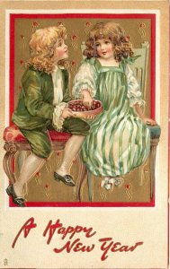 Tuck New Year Postcard 139 Children Boy & Girl in Green on Bench Eat Chocolates