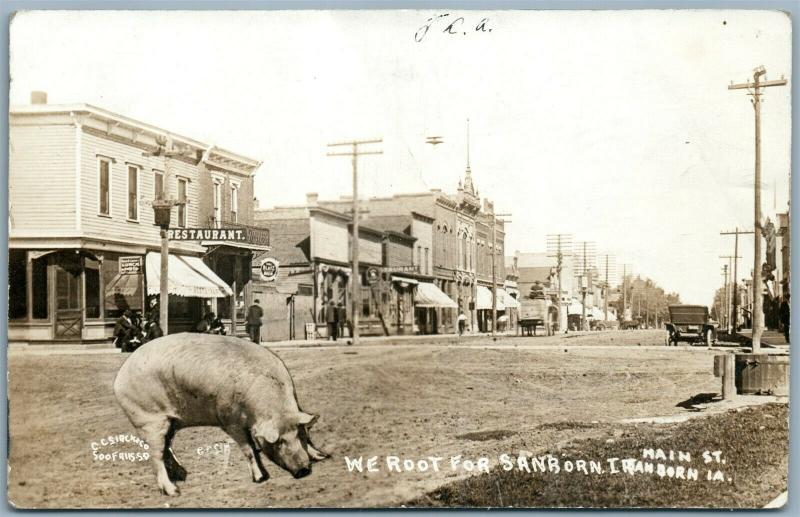 SANBORN IA MAIN STREET SCENE w/ PIG 1912 ANTIQUE PHOTOMONTAGE REAL PHOTO RPPC