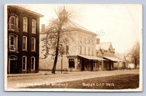 J87/ Quaker City Ohio RPPC Postcard c10 Cambridge Business Stores Broad. 1693