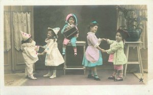 C-1910 Girl children clown Accordion Hand Tint RPPC Photo Postcard 21-11723