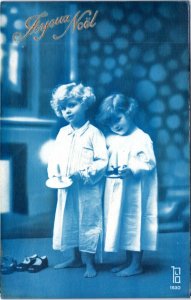 Postcard French Christmas blue tint Children in nightgown with candlestick
