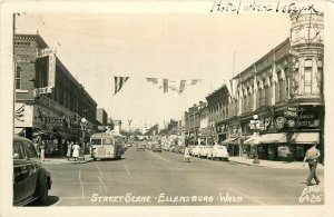 1949 Ellensburg Washington Street Scene bus autos people RPPC Postcard 26-525