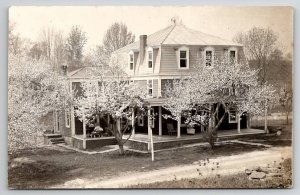 RPPC Lovely House Pyramid Hip Roof Flowering Trees Woman Reading Postcard H28