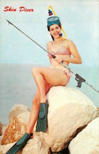 Sexy bathing suit woman posing with fishing Skin Divers 1950s Postcard 24-8516