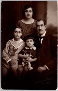 Family Picture Father Mother and Two Sons Real Photo RPPC Postcard