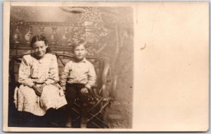 Siblings Children Sitting on Wooden Chair Photograph RPPC Postcard