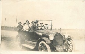 Postcard RPPC 1916 Large automobile road trip woman driver 23-10651