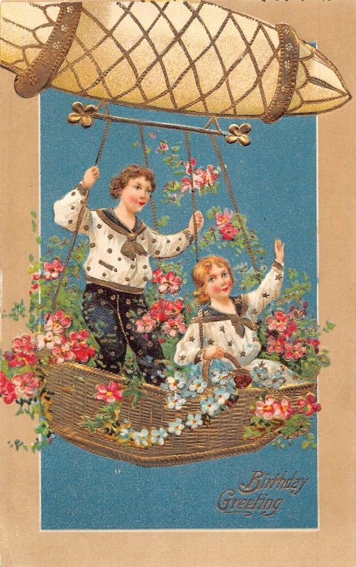 L180 Birthday Greeting children flowers hot air baloon embossed postcard