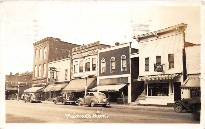 G21/ Plainwell Michigan RPPC Postcard 1941 Stores Autos Sweet Shop