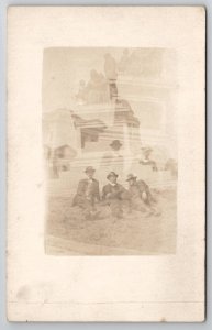 RPPC Double Exposure Handsome Men Laying on Lawn Monument Postcard D26