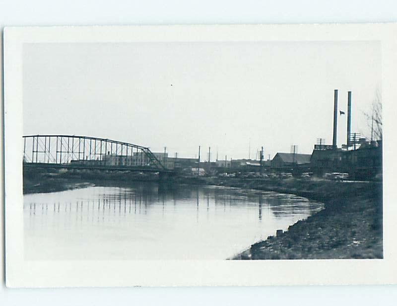 1944 rppc BRIDGE BY SHOPS ALONG THE STREET Fairbanks Alaska AK HM3998