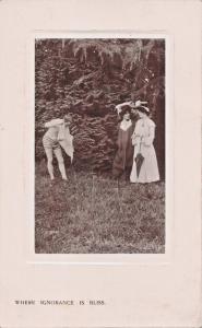 WHERE IGNORANCE IS BLISS-MAN UNDRESSING IN FRONT LADIES-BAMFORTH PHOTO POSTCARD