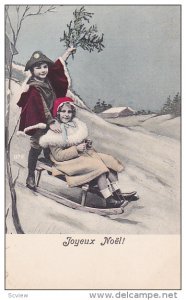 Joyeux Noel, Boy and girl playing in sleigh in the snow, 00-10s