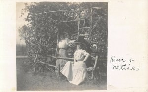 Rene & Nellie showing off their finery c1910 rppc postcard