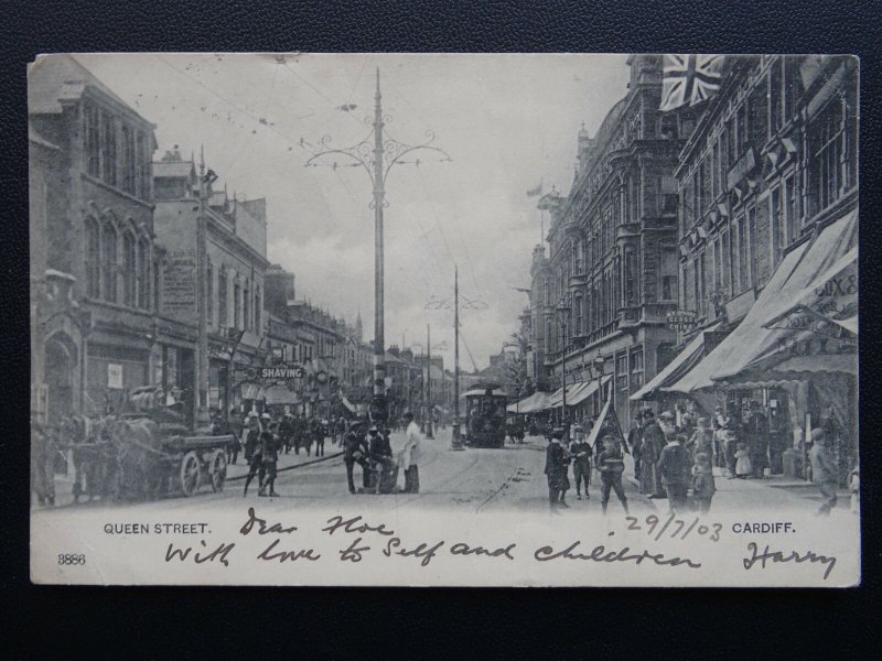 Wales CARDIFF Queen Street showing SHAVING PARLOUR, TRAMS used c1902 UB Postcard 