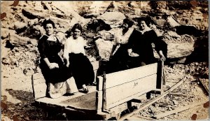 c1910 WOMEN RIDING IN MINE RAIL CAR IN QUARRY REAL PHOTO POSTCARD 17-28