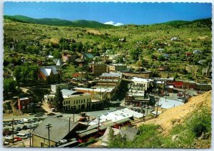 Postcard - Mine-scarred hills & the Victorian facade of its buildings - Colorado