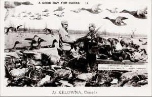 Kelowna BC Exaggeration Good Day for Ducks Birds Duck Hunters RPPC Postcard E82