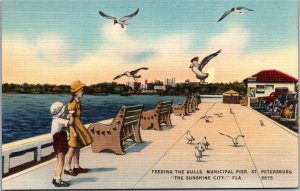 Postcard FL St. Petersburg children feeding the gulls on municipal pier