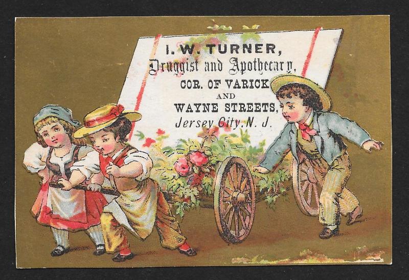 VICTORIAN TRADE CARD Turner Druggist Three Kids Pulling Cart & Flowers