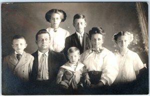 c1910s Charming Large Family of 7 Portrait RPPC Cross Eyed Boy Real Photo A142