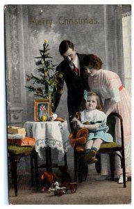 1910s Merry Christmas Little Girl with her Parents and Teddy Bear Postcard