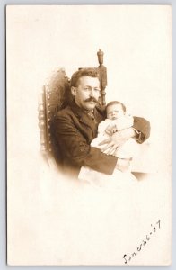 Chicago Fair Vignette RPPC~Common Man~Ornate Studded King's Chair~Father~Infant