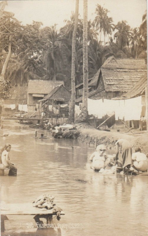 RP: PHILIPPINES , 00-10s ; Women doing Laundry in River