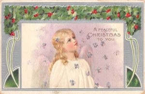Christmas Greetings Angel with Purple Flowers Holly Border Postcard AA72144