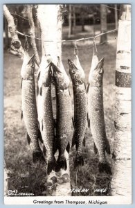 1940-50's RPPC GREETINGS FROM THOMPSON MICHIGAN NORTHERN PIKE LL COOK POSTCARD