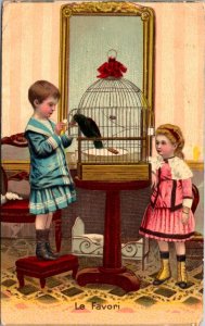 Postcard Le Favori Two Children with a Black Bird in a Bird Cage