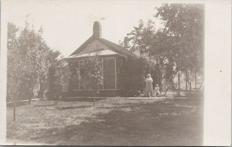 Woman and Child by House Broom Unknown Location Unused Real Photo Postcard F63