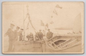 RPPC WW1 Era Navy Ship Sailors Small Boats Postcard J21