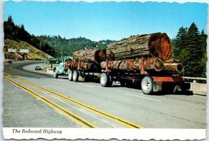 M-46098 Huge logging trucks at the Redwood Highway California