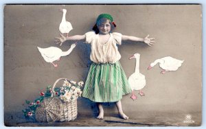 1915 RPPC ITALY PEASANT GIRL FLOWER BASKET GEESE ON WALL STRIPE SKIRT POSTCARD