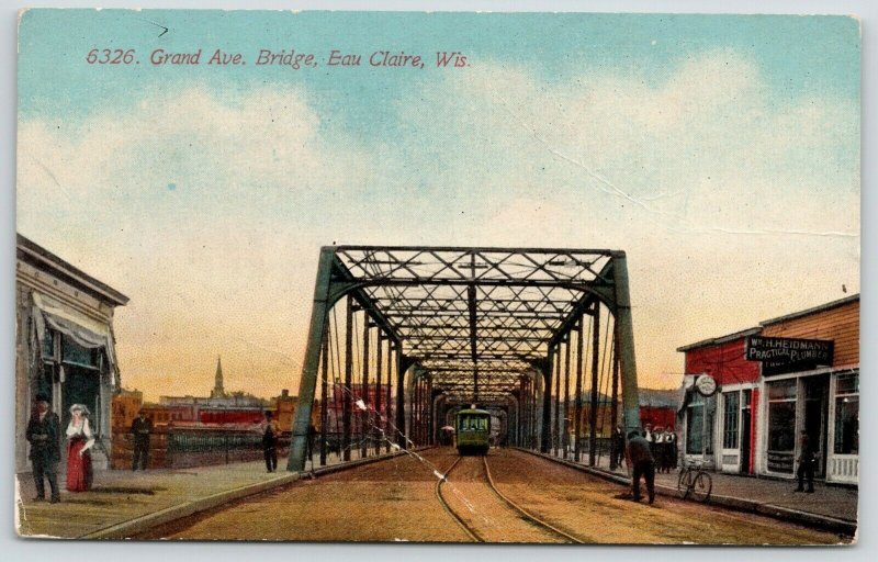 Eau Claire WI~Grand Avenue Bridge~Wm H Heidmann Practical Plumber~Trolley~c1910 