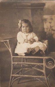 RPPC Postcard Cute Little Girl With Bow Sitting on Chair Felker Studio Easton PA