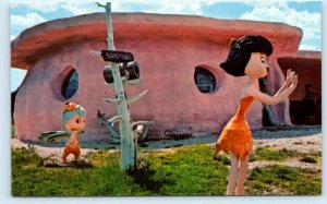 CUSTER, SD South Dakota ~ c1960s  FLINTSTONES BEDROCK CITY ~ Betty & Bamm Bamm