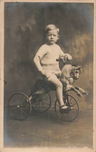 YOUNG BOY RIDES HOBBY HORSE TRICYCLE~TREHERBERT WALES UK REAL PHOTO POSTCARD