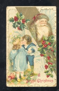JOYFUL CHRISTMAS VICTORIAN SANTA CLAUS GOLD ROBE CHILDREN KISSING OLD POSTCARD