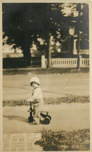 c1910 RPPC Small Child on Home-made Wooden Scooter / Tricycle, Unknown US