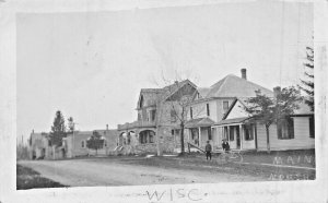 WISCONSIN~MAIN STREET-HOUSES-STONE HOUSE-BOYS-BICYCLE~1910s REAL PHOTO POSTCARD