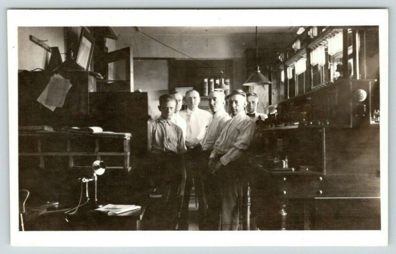 RPPC Six Men Inside Crowded Office~Coat Hooks on Wall~Candlestick Phone~c1918 