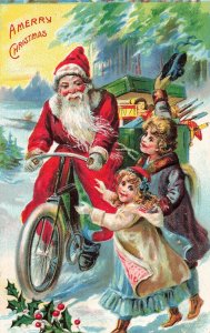 CHILDREN RUN & SANTA CLAUS RIDING BICYCLE-BOX OF TOYS~1910s CHRISTMAS POSTCARD