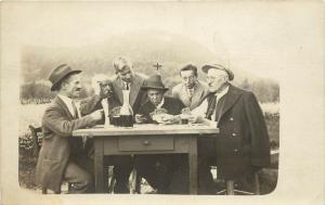 1931 RPPC Men Playing Cards & Drinking Wine Outside, Unknown Eastern Europe 
