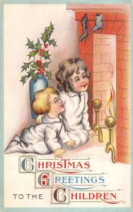 Christmas Greeting Children Near Fireplace Antique Postcard K25629