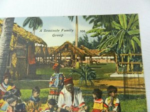 PPC POSTCARD NATIVE AMERICAN A SEMINOLE FAMILY GROUP MAN TEACHING CHILDREN