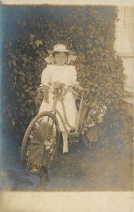 Postcard RPPC C-1910 girl bicycle parade festoon TP24-3513