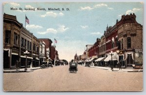 Mitchell South Dakota~Main St North View~USA Flag~Drugs Sign~Automobile~c1910 PC